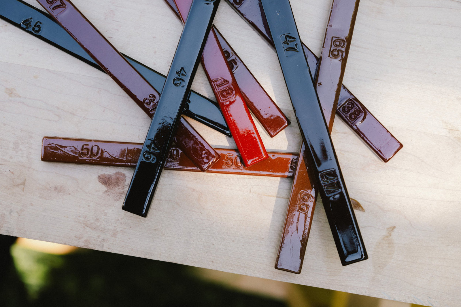 Burn-in sticks arrayed in mahogany context